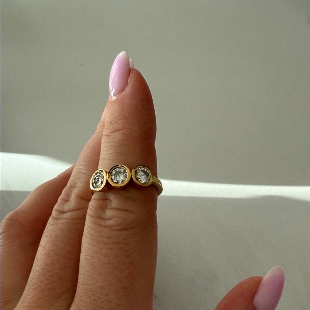 Gold Three-Stone Bezel Set Ring with Clear Stones